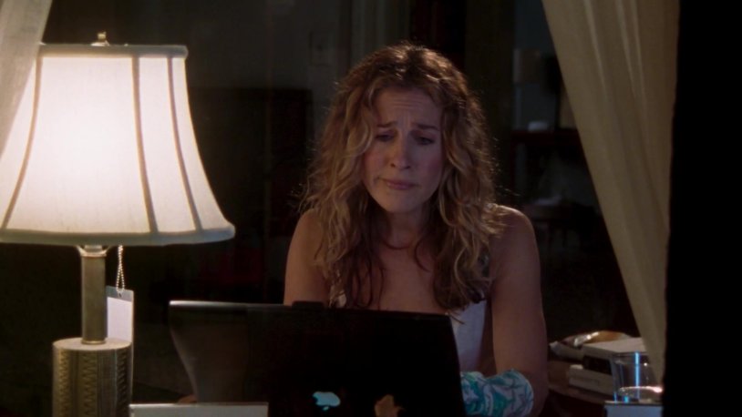 Carrie Bradshaw at a computer