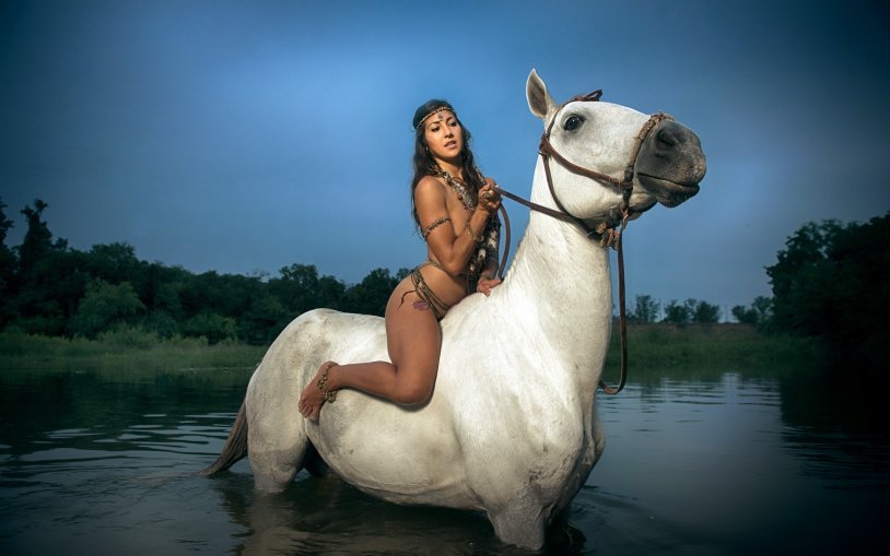 Salma Hayek riding a horse