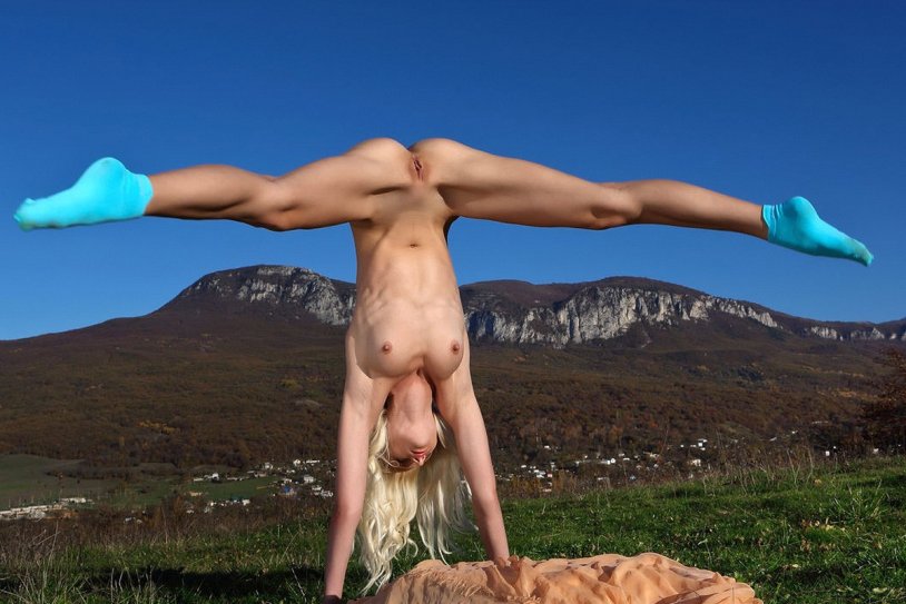 The naked woman was hung by the leg