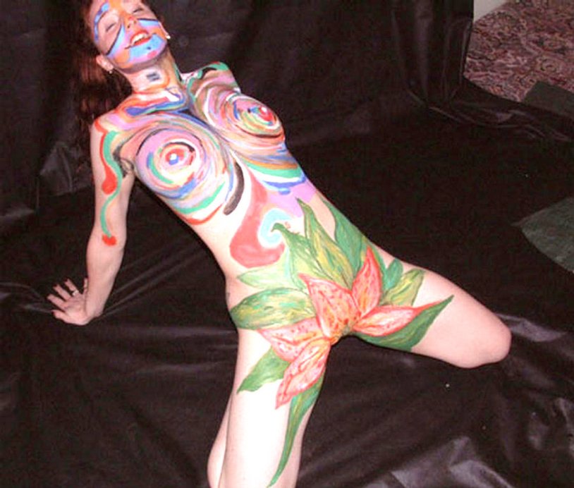 Naked women painted with paint
