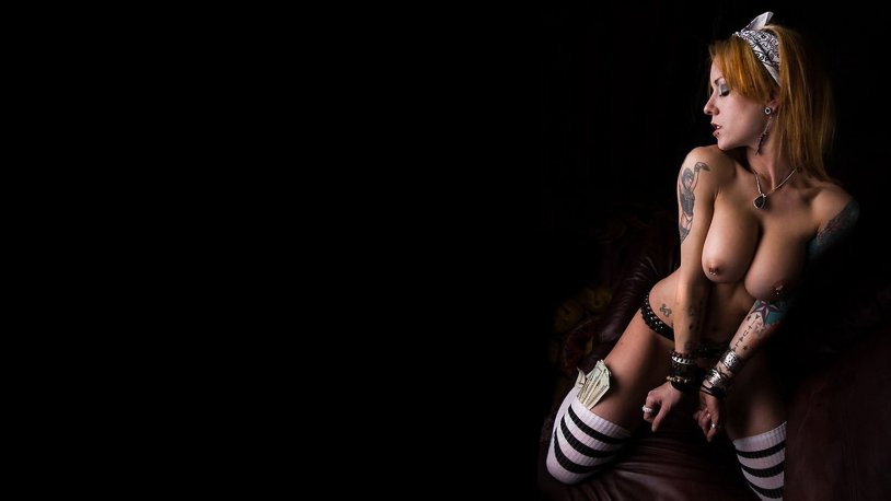 Naked woman with Doberman