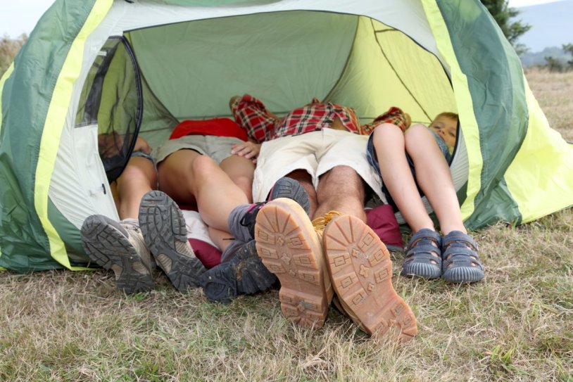 Women's legs in a tent