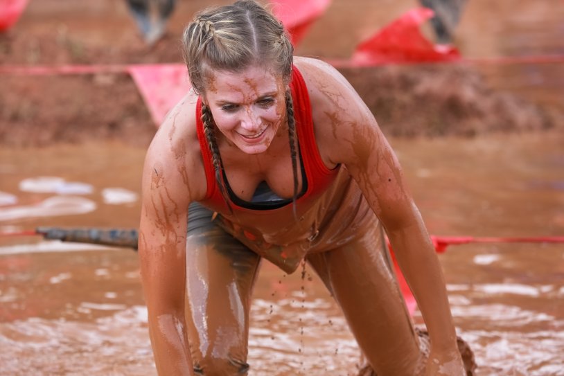Girl in mud without clothes
