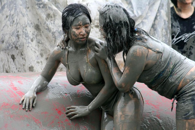 Girl at the mud festival