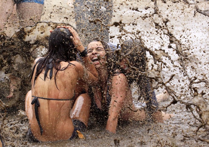Girls in the mud bathing