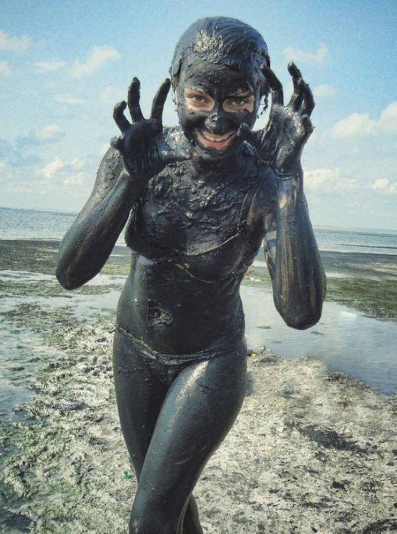 Girls in the mud bathing