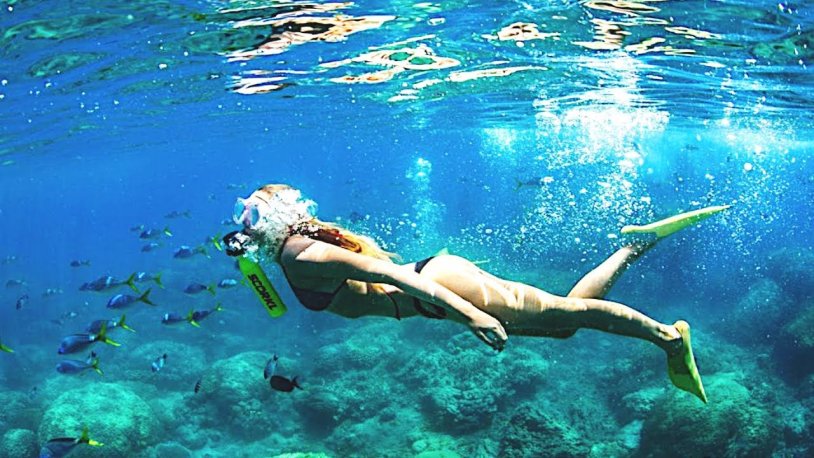 Girl in flippers underwater