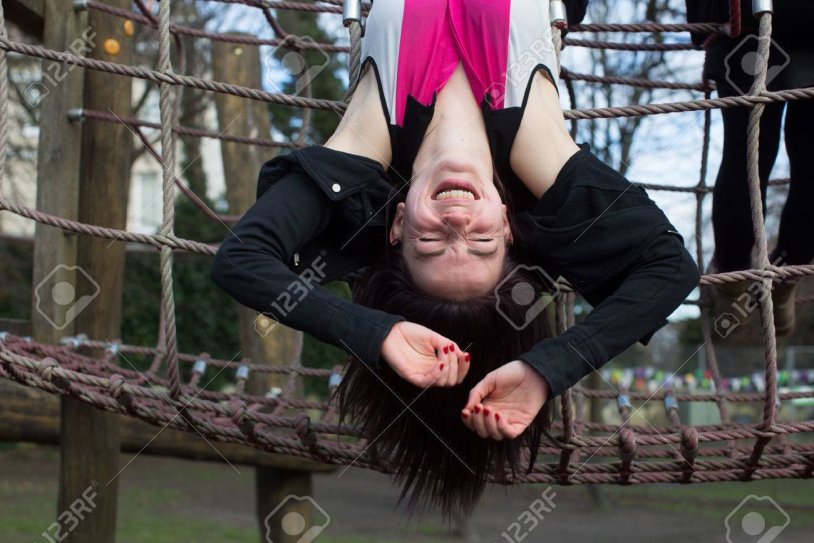 A person hangs upside down