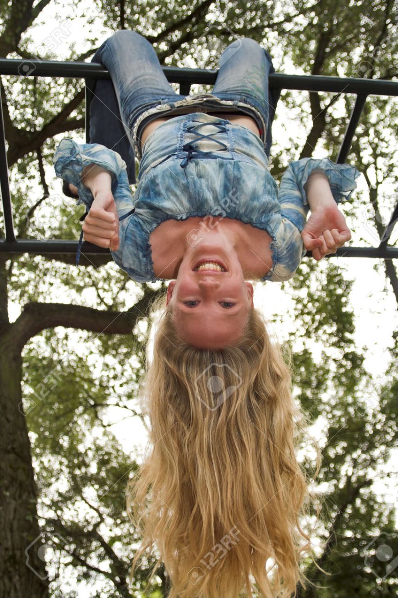 The girl hangs upside down