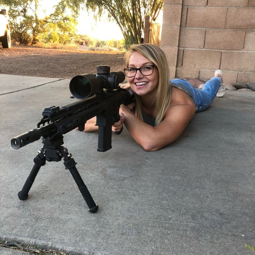 Girl with a rifle barret