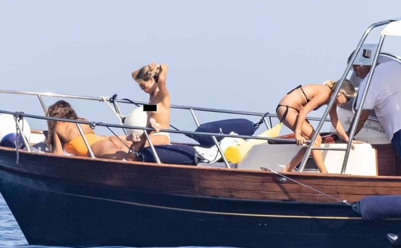 Princess's husband Eugene on a yacht with models
