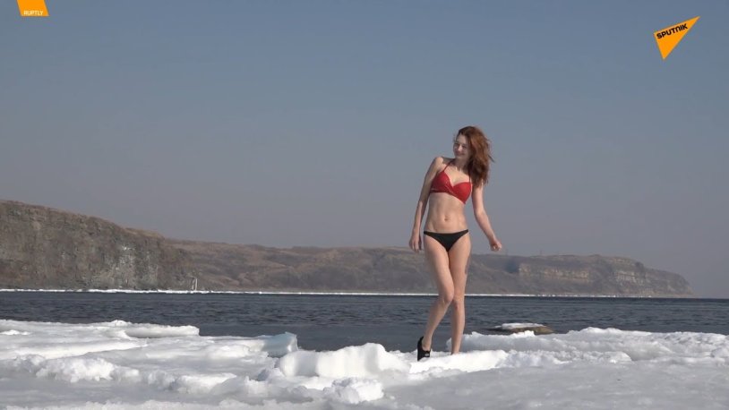 In a swimsuit on the ice sea