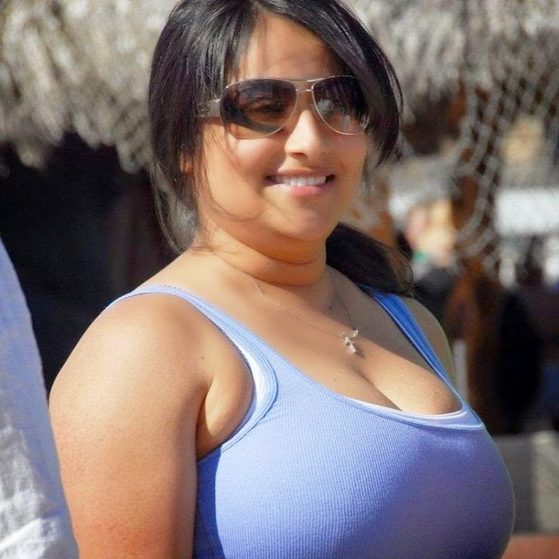 Lush brunette in a short chubby dress