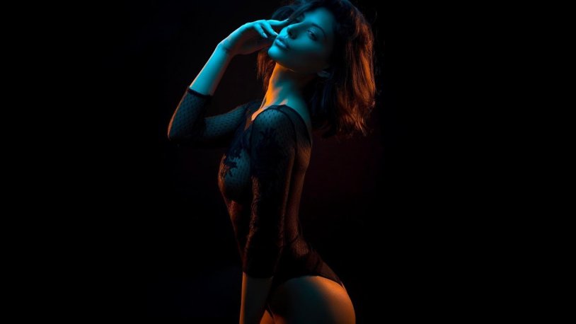 Girl in linen on a black background