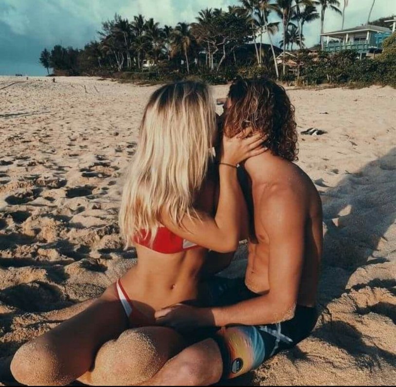 A guy with a girl at sea