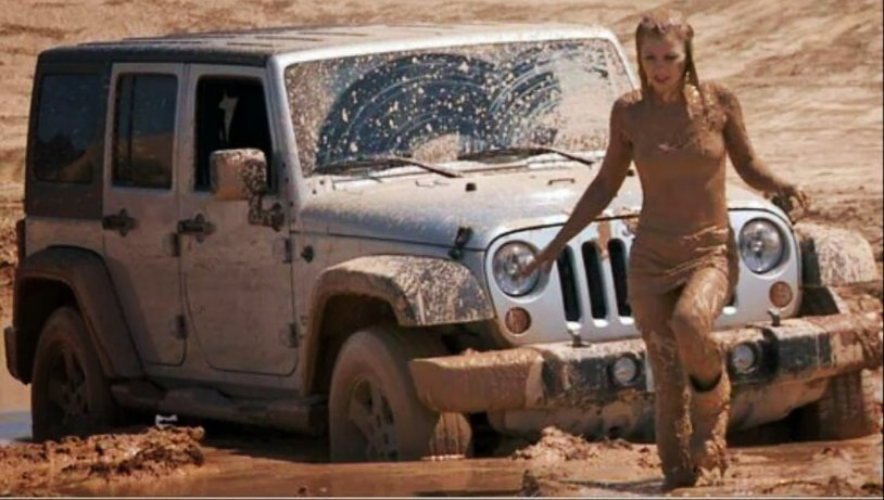 Girl in a jeep in mud
