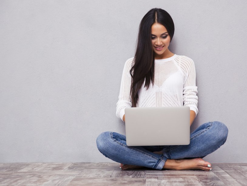 Girl sits with a laptop