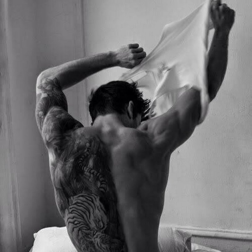 Male back on the bed