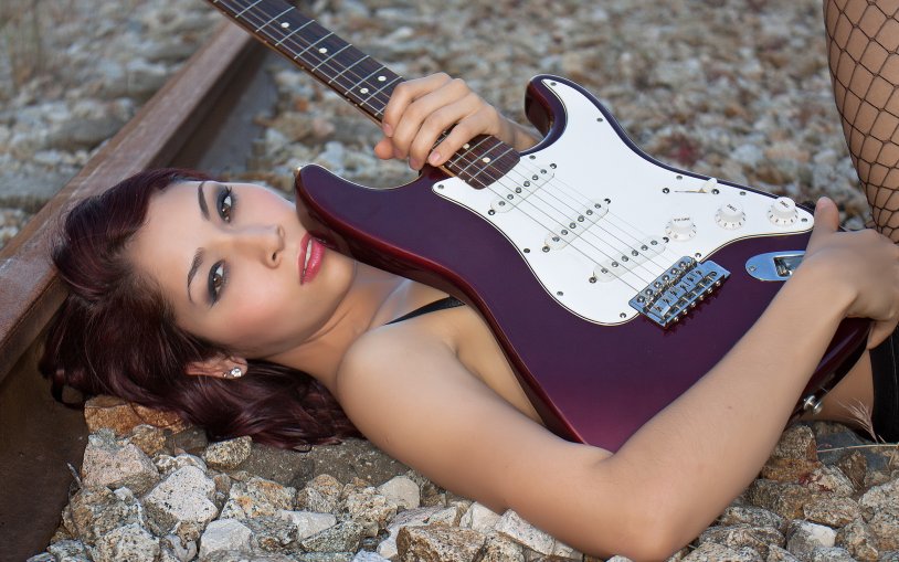 Brunette woman with guitar