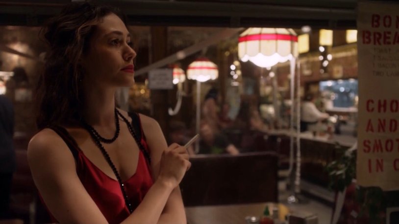 Fiona Gallager in a red dress