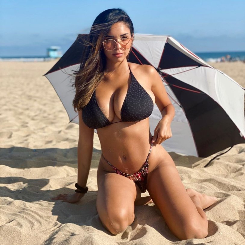 Bikini Big Tits on the beach in a black cap