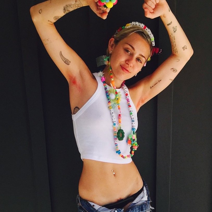 Miley Cyrus with unshaven armpits
