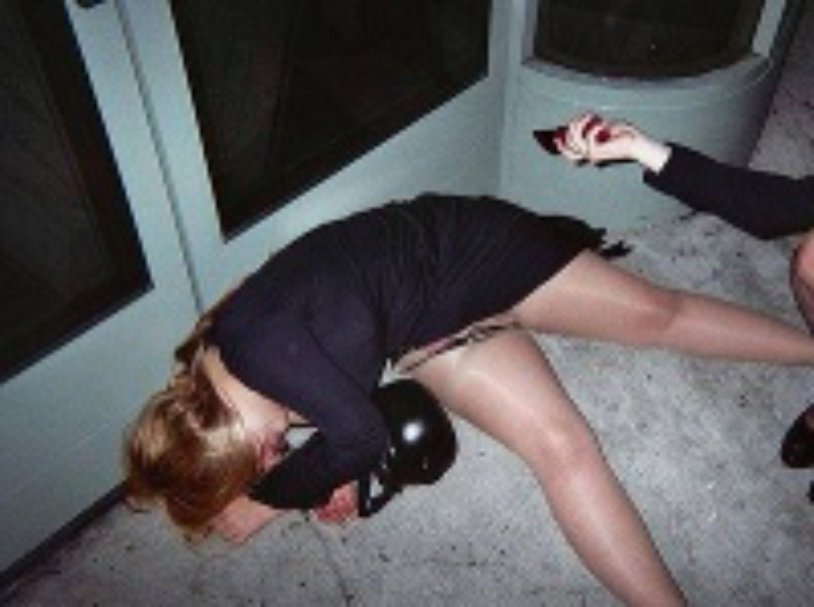 A drunken woman is lying around