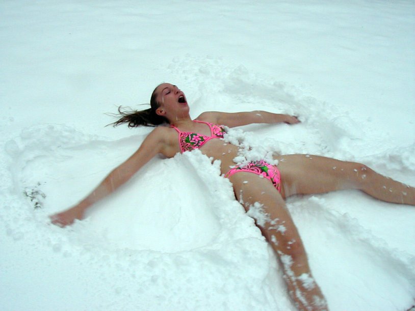Girl in the snow in a swimsuit