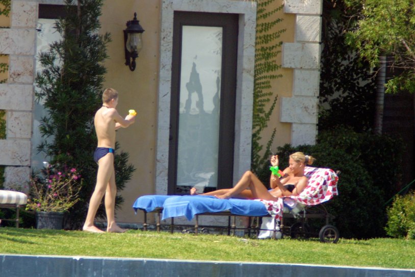 Sunbathing on the roof of topless