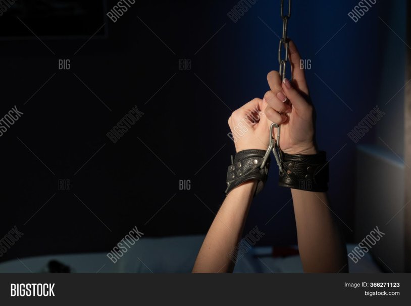 Tied girls in handcuffs