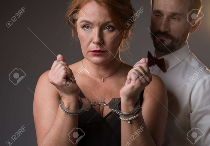 Adult woman in handcuffs