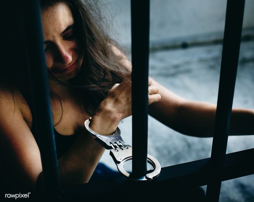 Beautiful girl behind bars