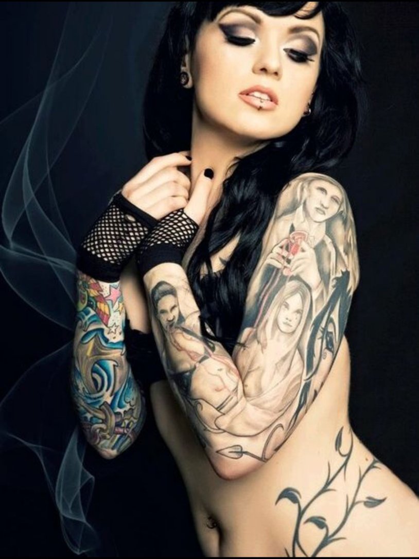 The girl is all in tattoos