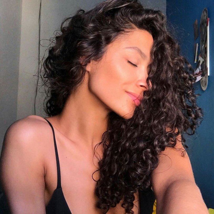 The girl is a curly brunette