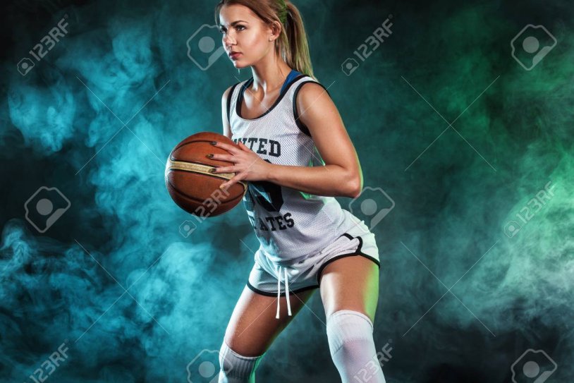 Photo shoot with a basketball ball girl in the studio