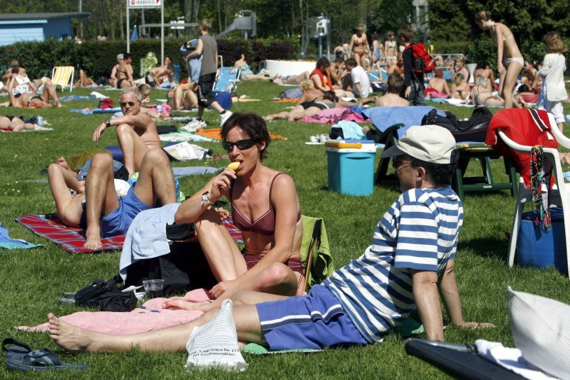 Naked Germans in the park sunbathe