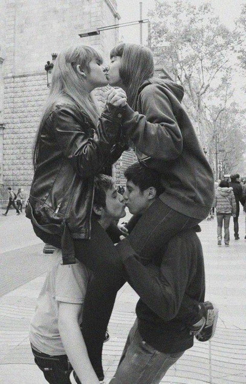 Two girls and guy kiss