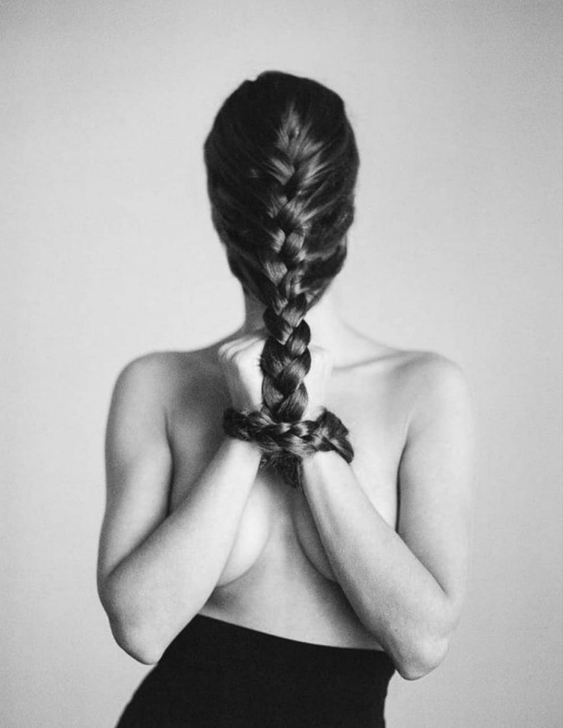 Naked brunette with long hair