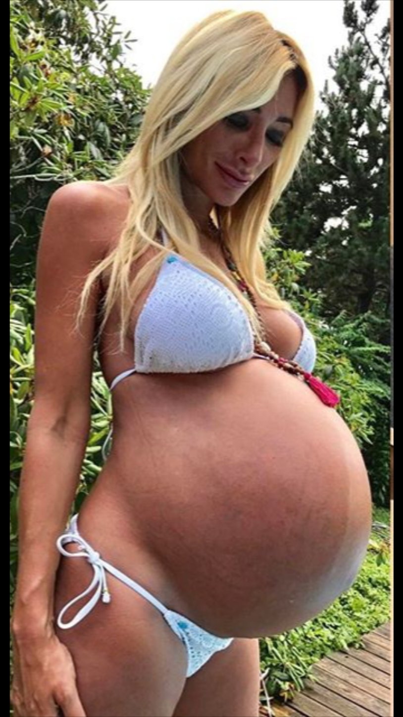 Huge boobs of a pregnant woman