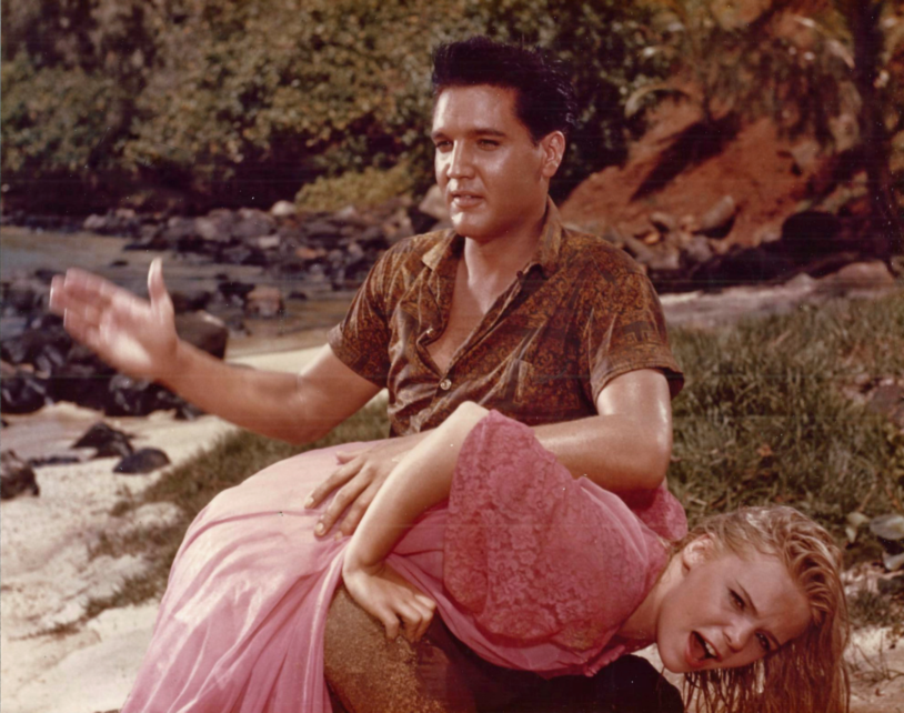 Elvis Presley is slapping