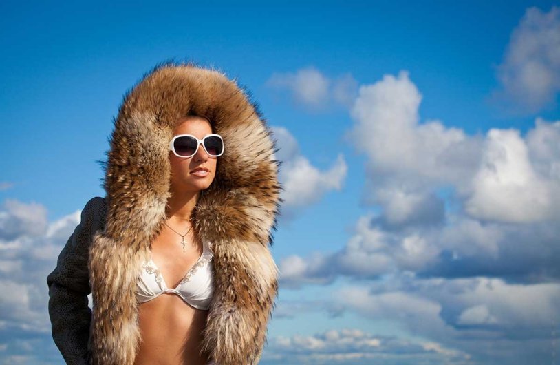 Girl in a fur coat and swimsuit