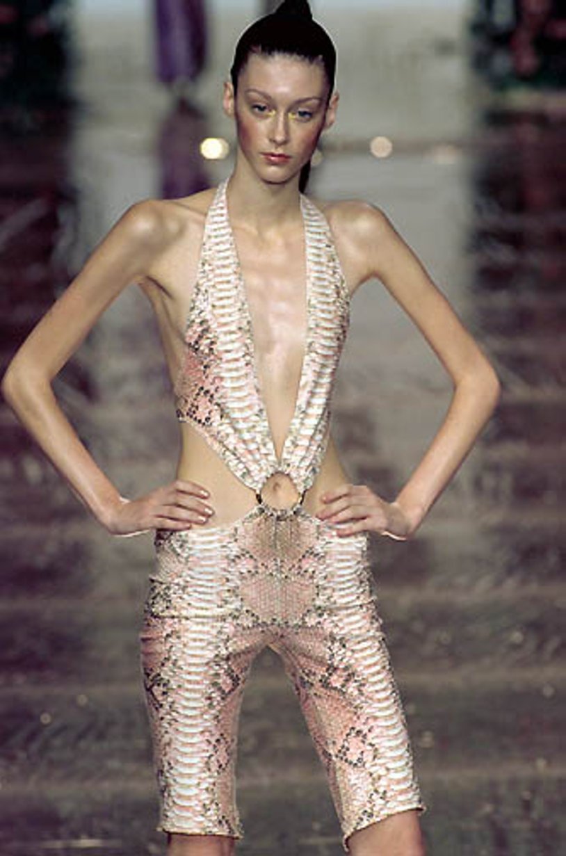 Naked fashion model on the catwalk
