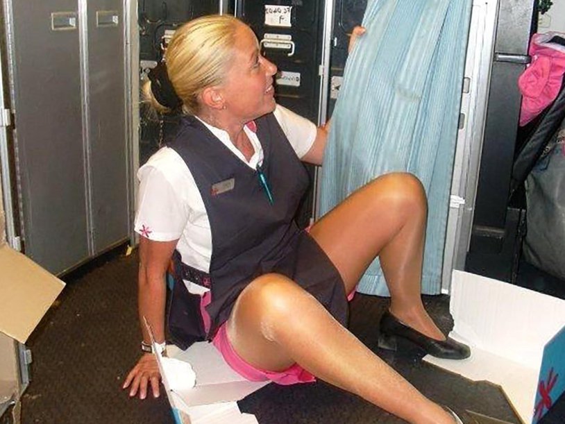 Stewardesses have fun in an airplane