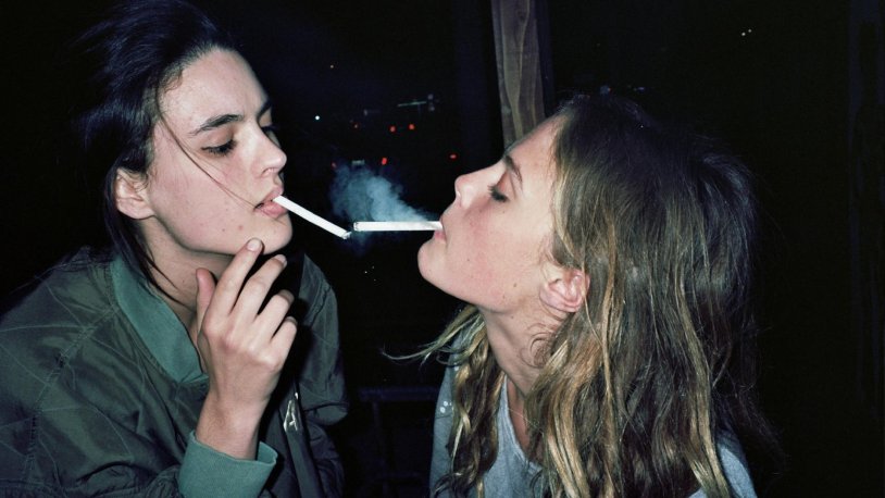 Several girls smoke