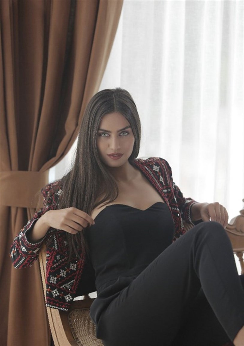 Demi Rose in a red dress