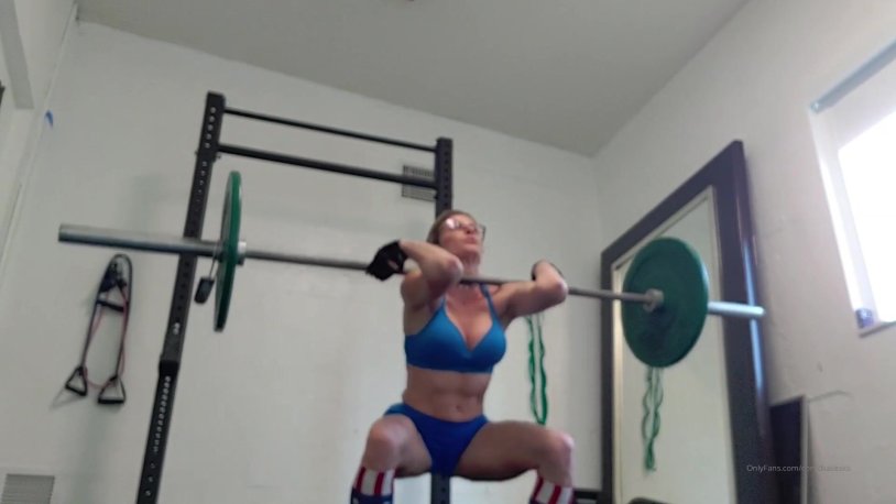 Squats with a wide setting of legs bar