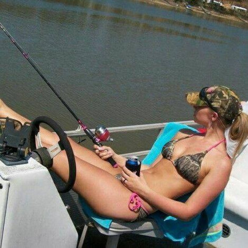 Girl in a boat with a fishing rod