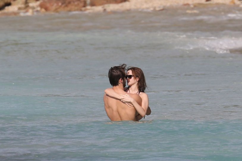 Emma Watson in a swimsuit with a guy