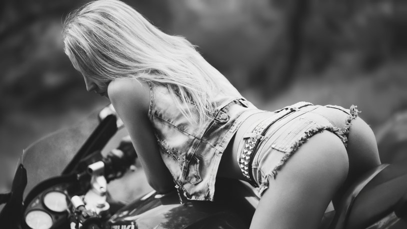 Girl on a motorcycle behind