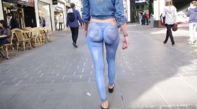 Girl walking in painted jeans